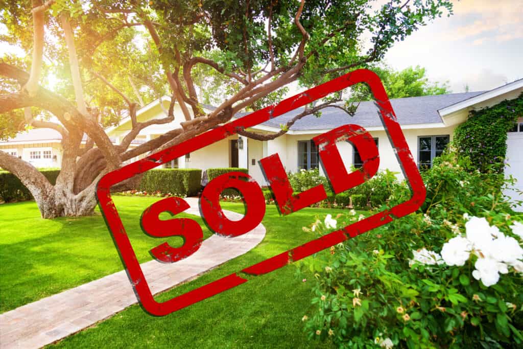 Beautiful House With Sold Stamp Overlay AdobeStock 134906261
